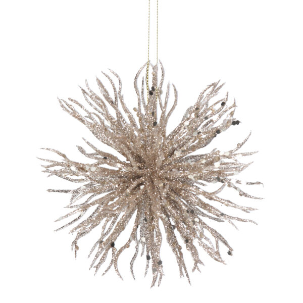 A pale gold starburst decoration with gold glitter accents hanging from a gold thread.