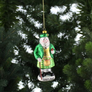 A Scottish Santa Claus ornament hanging on a tree.