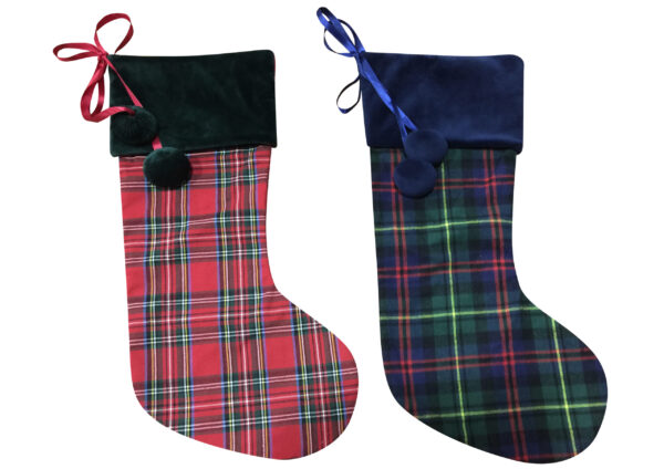 Two plaid christmas stockings on a white background.