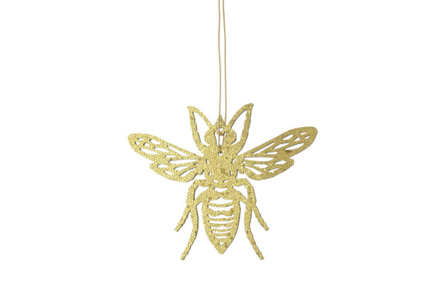 A gold bee ornament hanging from a string.