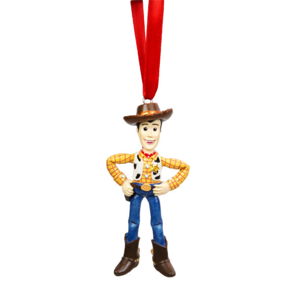 Woody from the Disney movie Toy Story hanging on a red ribbon. figure about 7cms tall. Woody is wearing his usual brown cowboy hat, yellow checked shirt with cow skin waistcoat, blue jeans and brown cowboy boots. Woody is standing with his hands on his hips.