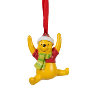 Disneys Winnie the Pooh wearing his iconic half red jumper, a pale green stripy 'knitted' scarf and a traditional red santa hat with white trim. Pooh is in the jumping for joy pose, arms up, legs in a splits position and is suspended using a red ribbon. Winnie the Pooh is 9cms high.