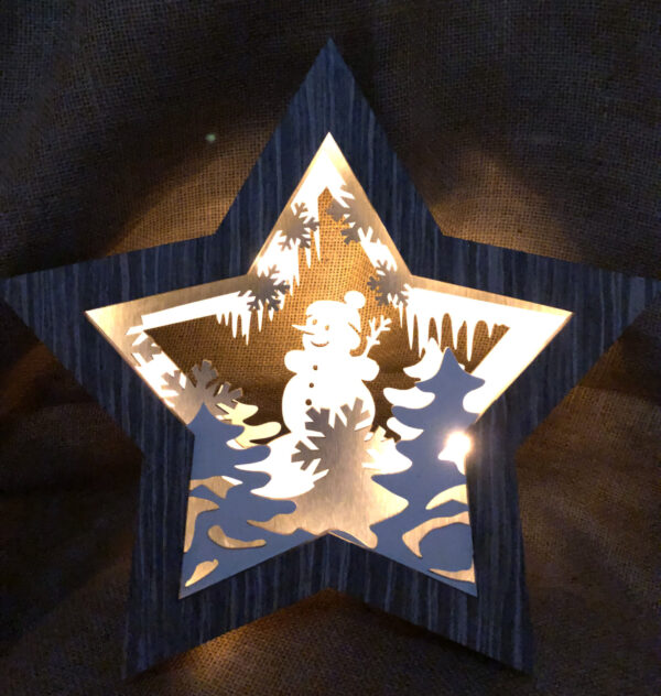 An illuminated grey wooden, light-up star with Snowman detail Christmas decoration.