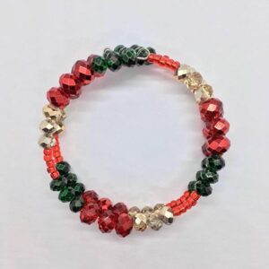 An Elegant Red, green and gold beaded bracelet.