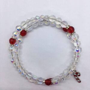 A hand made iridescent and ruby beaded bracelet with a silver candy cane charm.