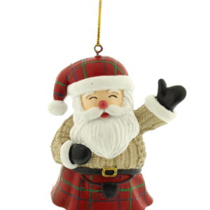 A polyresin Scottish Santa Christmas Tree Decoration. Santa wears a red tartan kilt complete with belt and sporran. He has matching tartan Santa hat with white trim. He wears a cream coloured cable knit jumper and black boots and gloves. He has a jolly face and is waving his left arm as a greeting. He hangs from a gold string.