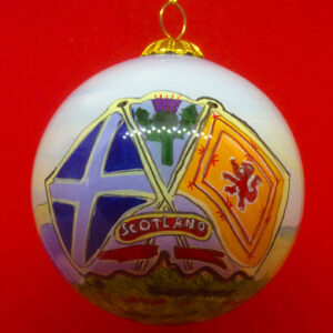 A beautiful handpainted bauble, decorated with the two flags of Scotland. The Saltire on the left and the Lion Rampant on the right. Their poles are crossed and the word 'SCOTLAND' sits in a banner across the middle. Between the flags sits the national flower of Scotland, a Thistle.