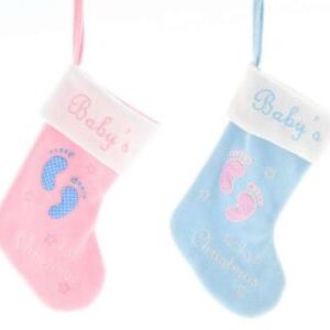 Two Baby's First Christmas stockings. The stocking on the left has a white cuff with the text 'Baby's' embroidered in pink, beneath that on the pink body of the stocking is a pair of blue appliqued baby feet, four pink stars and embroidered text in white that reads '1st Christmas'. The stocking on the right has a white cuff with the text 'Baby's' embroidered in blue, beneath that on the blue body of the stocking is a pair of pink appliqued baby feet, four pink stars and embroidered text in white that reads '1st Christmas'.