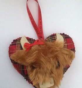 A Handmade fluffy Scottish highland cow shaped decoration on a red tartan fabric heart.