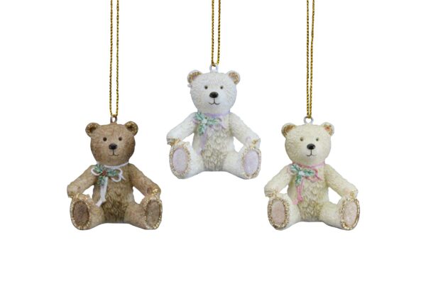 Three Victorian teddy bear tree decoration ornaments in various colours hanging on a chain.