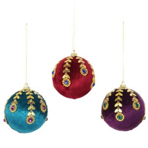 Three bejewelled baubles in various rich colours hanging on a white background.