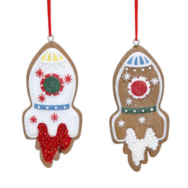 Two Iced gingerbread rocket shaped tree decorations with a space ship icing decoration on them.