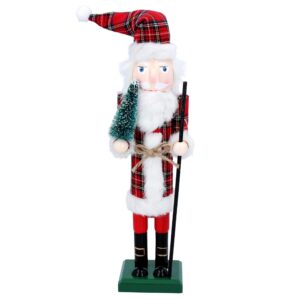 A Tartan clad, Santa Nutcracker, 38cm holding a tree.