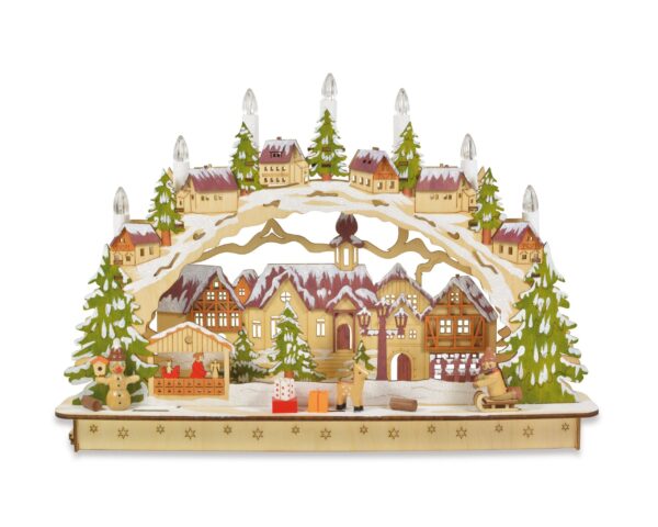 A colourful Germanic style Wooden Candle Arch Mantlepiece decoration with winter village scene featuring snow topped houses and Christmas trees and seven battery operated candles. The trees are coloured green and the rooftops orange.