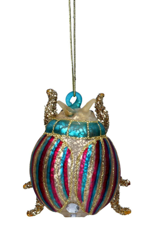 A set of two, blown antique gold glass beetles, tree decorations. The one on the left has a round body with green and brown vertical stripes across its back and neck with gold glitter detail and red diamante spots at the base. The one on the right has a round body with red and blue vertical stripes across its back and neck with gold glitter detail and white diamante spots at the base. Both are on gold strings.