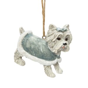 Polyresin White Westie Dog Hanging Christmas Decoration. A cute white Westie dog wearing a pale blue coat with white trim with matching blue bow on it's head.