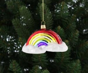 A blown glass Christmas tree decoration in the shape of a rainbow in the clouds decorated in bright metallic rainbow colours, hanging on a gold string.