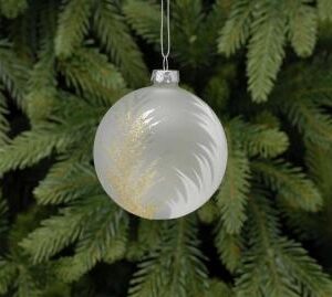 A frosted clear glass Christmas bauble with gold glitter and white feather motifs on both sides.