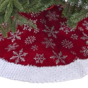 A round burgundy velour tree skiet decorated with sparkly silver snowflakes with a white velour trim decorated with silver sequins.