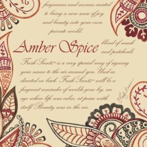 An Amber Spice fragranced scent sachet featuring a border of decorative Paisley patterns in vaious shades of orange, red, black and burgundy on a cream background. In the middle in large burgundy text it reads 'Amber Spice' this text is surrounded by smaller text in brown describing the qualities of the fragrance within.