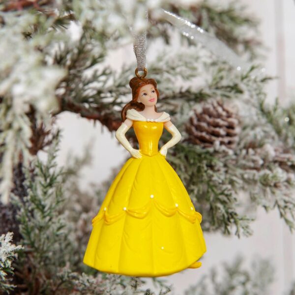 Princess Belle from Beauty and the Beast wearing her beautiful yellow ball gown. Her dress is yellow and is decorated with dark gold swags around the pleats. Each swag is decorated with a white rose that matchd the three roses along her lemon swag collar. She is also wearing lemon yellow evening gloves. She hangs from a silver glitter ribbon, ready to hang on your tree.