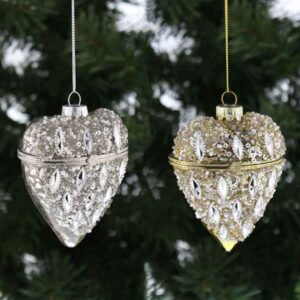 Two glass Heart shaped trinket box Christmas tree decorations. The one on the left is silver and the one on the right is gold. Both have an antique glass effect on the back while the fronts have been decorated with sparkly beads, glitter and sequins.