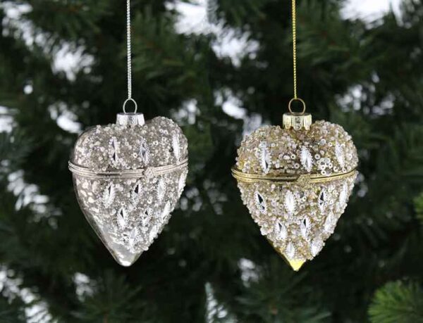 Two glass Heart shaped trinket box Christmas tree decorations. The one on the left is silver and the one on the right is gold. Both have an antique glass effect on the back while the fronts have been decorated with sparkly beads, glitter and sequins.