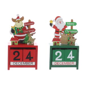 Wooden Advent Block Calendars in two designs. The one on the left is red and features Rudolph wearing a red Santa suit and holding a green present with a yellow bow. He is standing next to a red sign that reads 'Seasons Greetings' in white text. In front of Rudolph and the sign is a small green house and a little brown reindeer. They all sit on top of a red wooden box containing the two number blocks for counting down the days of advent and the block sit on top of another white block that says 'DECEMBER'. The one on the right is green and features Santa Claus holding a yellow bell. He is standing next to a green sign that reads 'Merry Christmas' in white text. In front of Santa and the sign is a small green house and a little brown reindeer. They all sit on top of a green wooden box containing the two number blocks for counting down the days of advent and the block sit on top of another white block that says 'DECEMBER'.