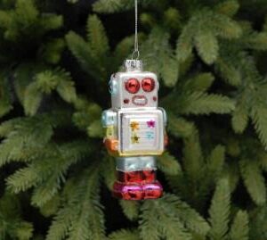 A traditional blown glass Chriatmas tree decoration depicting a cute silver 1950's style box shaped robot. The main colour of his body is silver. he has large round metallic red eyes, colourful stars on his chest and metallic cyan, green and orange coloured arms. His 'boots' on his legs are metallic magenta. He hangs from a silver string..