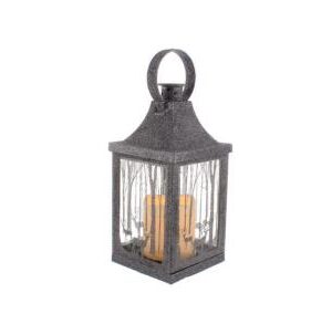 This metal lantern is coated with a dark silver glitter. The four glass panels of the lantern feature a forest scene with deer in the same colour of glitter. Inside the lantern is a large battrey operated faux candle which is giving off warm white glow.