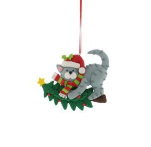 A claydough Christmas tree decoration in the shape of a gray cat hanging on a fallen Christmas tree. The cat is wearing a red Santa hat adorned with a sprig of holly and a green and red stried scarf with a white fringe. Tree is decorated with red baubles and a gold star. it hangs from a red ribbon.