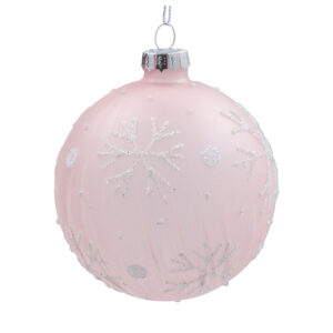 A matt pink glass Christmas tree bauble decorated with white glitter snowflakes and polka dots.