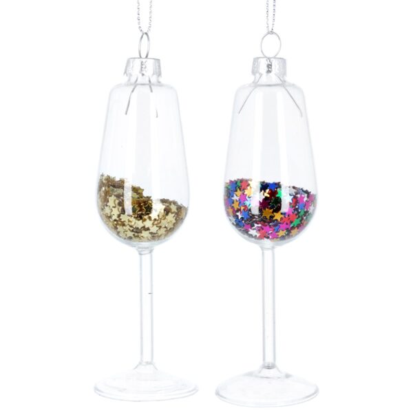 A pair of clear glass Christmas tree baubles in the shape of wine glasses. The wine glass on the left is filled with tiny gold glitter stars while the one on the right is filled with tiny multicoloured stars. Both hang from silver strings.