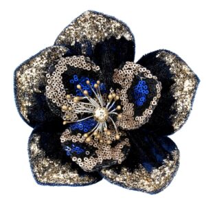 A navy and gold fabric, clip on, Magnolia flower. The outside petals of this clip on flower are made of dark navy velour fabric with matching gold glitter on the tips, the internal petals are black with pale gold, royal blue and black sequins, the stamen in the centre is gold glitter with gold beads on stems.