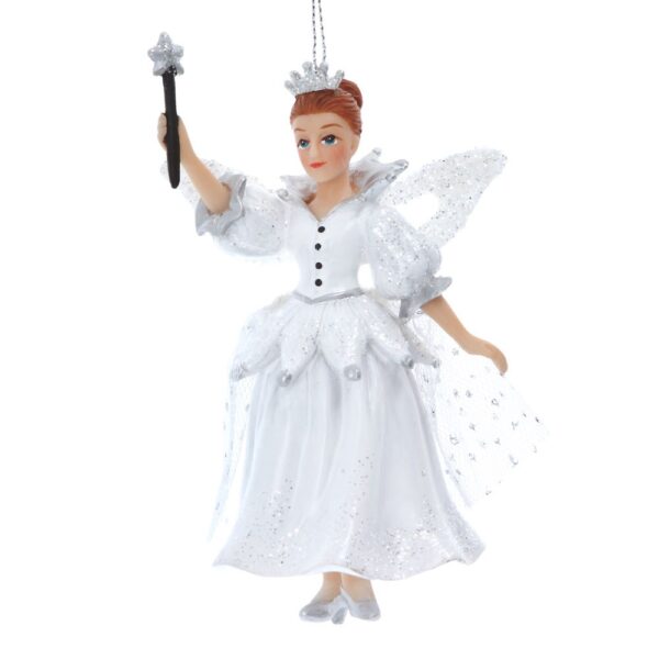 A polyresin figurine Christmas tree decoration depicting a classic Fairy Godmother. This fairy godmother is wearing a white dress white silver glitter accnets, she has a petal shaped peplum around her waist which has silver bells at the tips of the petals. her bodice is white with black buttons up the centre and a silver belt at her waist. She has puff ball sleeves with silver petal cuffs and a matching standing, ruffle collar. Her shoes are silver and she has a fine mesh cape with silver polka dots that hangs down from her silver glitter encrusted fairy wings. She wears a sparkly, silver glitter tiara in her hair and is holding a star shaped wand up in her right hand, ready to make a wish.