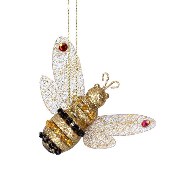 A gold bee Christmas tree decoration. The body of the bee is covered in gold glitter with yellow and black diamante jewel stripes. Its clear wings have a gold glitter marbled effect running through them an the tip of each wing is decorated with a red/gold coloured iridescent jewel.