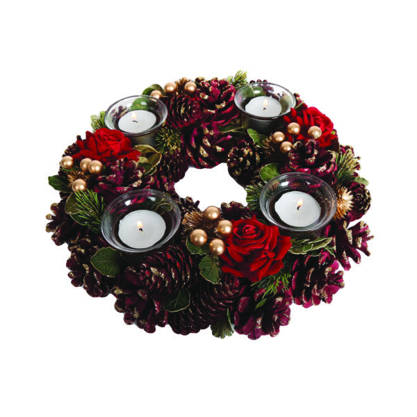 A Festive Red Round Tealight Holder Centrepiece with red pine cones with gold glitter frosting, red roses, gold berries and green foliage. There are four glass holders for tea light candles.