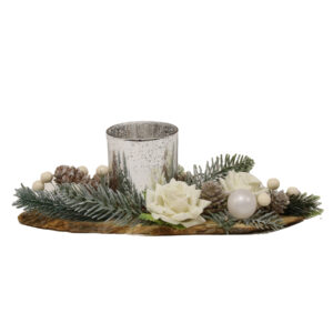 A white floral and wood base tealight holder with faux flowers, fir tree sprigs and pine cones.