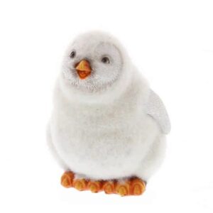 A flocked white baby penguin ornament. This baby penguin has a fuzzy flock material over most of hhis body. His face and wings are not covered in flock but have a carved feather detail instead. He has an orange beak and orange toes, his black eyes give him a cheeky expression.