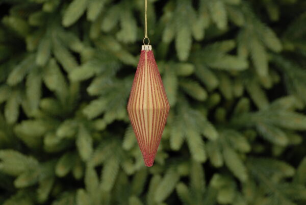 A matt gold, diamond shaped, ridged teardrop glass Christmas tree bauble decorated with fine lines of red glitter running down the edge of each ridge. Hanging from a gold string.