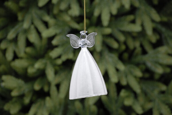 A tall clear glass Angel Christmas tree decoration. The long and voluptuous skirt of this angel has a white glitter frosting on the inside giving it an opage look from the outside. Her body, arms, head wings and halo are clear glass. Her wings are decorated with lines indicting feathers and her hands are clasped in front of her in prayer. She hangs from a gold string.