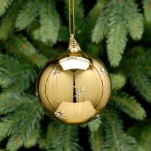 A gold metallic, glass Christmas tree bauble with small etched star that have tiny diamante jelwels in the centres. hanging from a gold string.