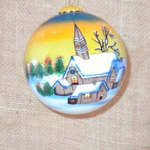 A Beautiful Hand Painted Bauble with a Snowy Church Scene set against a golden sky.