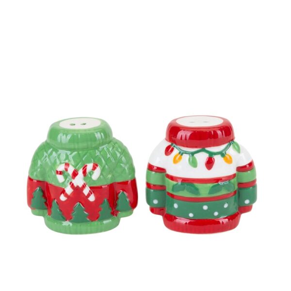 A set of ceramic salt and pepper shakers in the shape of Christmas jumpers. The jumper on the left is painted with green and red horizontal stripes with a pair of crossed candy canes on the chest and green Christmas trees around the hem. The jumper on the right decorated with red, green and white horizontal stripes decorated witha string of fairy lights around the neck, holly leaves and white polka dots.