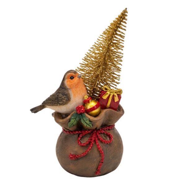 A polyresin Christmas ornament of a robin sitting on top a bag of Festive gifts including a red present, a gold bauble and a gold glitter brush Christmas tree. The bag is decorated with red string and a sprig of holly.