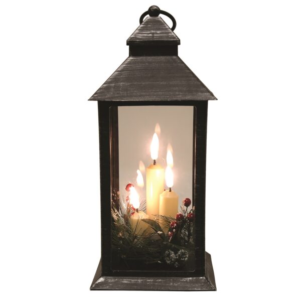 A 31cm Black Deco LED Lantern with three LED lit faux candles surrounded with sprigs of festive foliage and red berries.