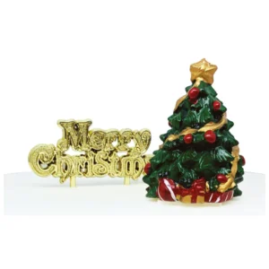 A polyresin Christmas Tree shaped cake decoration. The tree is green with a gold star on top. It is decorated with red baubles and gold ribbon on its branche and has wrapped presents nestled underneath. It is stood next to a gold plastic Merry Christmas motto cake decoration.