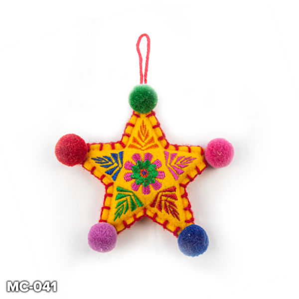 A yellow felt, star shaped Christmas tree decoration. This yellow felt star has a pink and green flower embroidered in the centre with colourful leaves embroidered in the points in orange, pink, red, purple and blue. It has red stitching around the outside. At the top there is a loop of red wool for hanging and the end of each point there is a colourful pompom in green, pink, blue, purple and red.