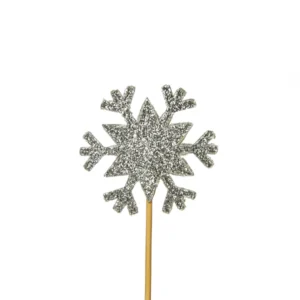 A glittery silver snowflake cake decoration pick.