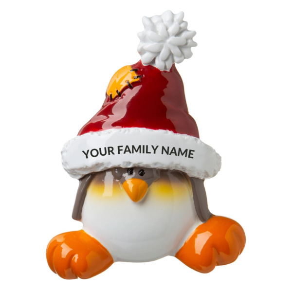 A polyresin Personalisable Christmas tree decoration in the shape of a Penguin. This penguin is wearing a large oversized Santa hat and on the white trim of the hat there is black text that says 'YOUR FAMILY NAME' implying the decoration can be personalised.